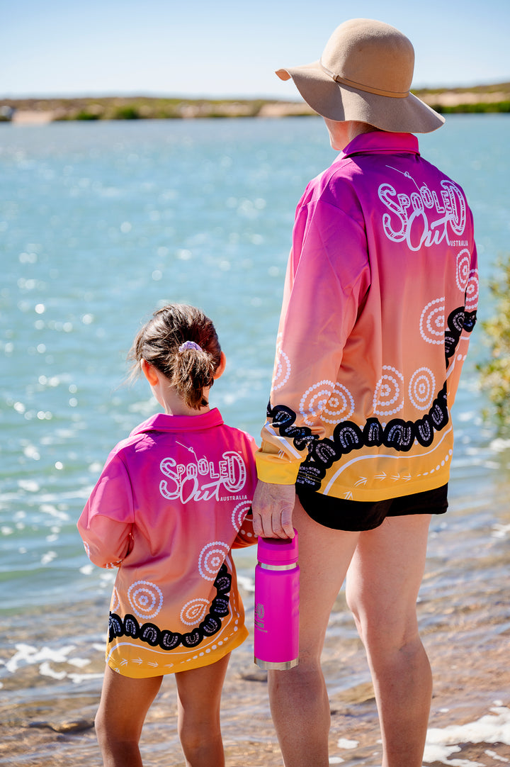 Community Within Fishing Shirt - Mum and child standing at water, back hero shot