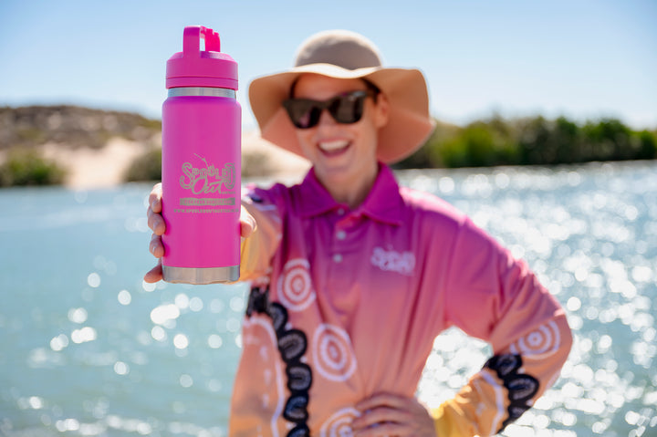 Community Within Fishing Shirt - Woman holding branded drink bottle, lifestyle detail