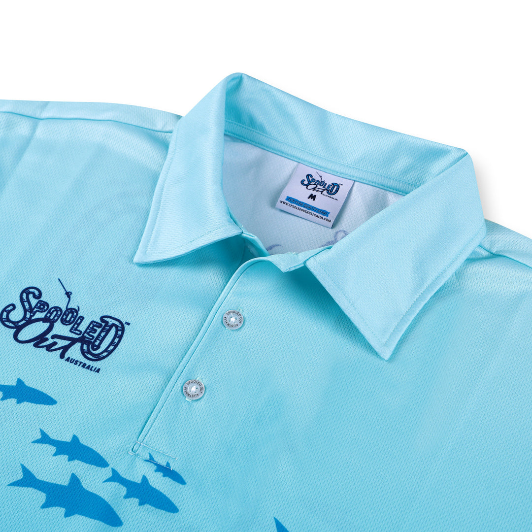 Close up of light blue spooled out australia shirt with custom buttons and high quality stitching